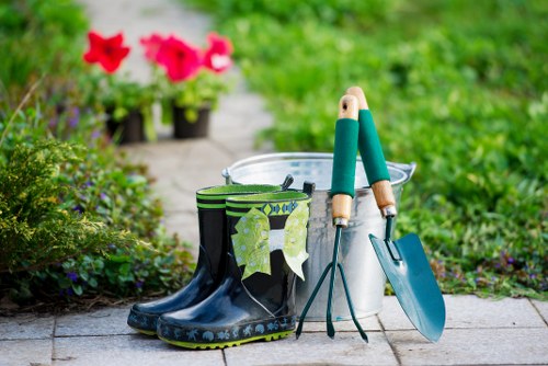 Team preparing for lawn mowing outside a Whitechapel property