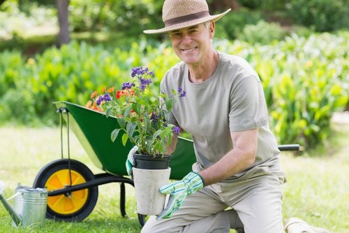 Professional tending to Whitechapel garden plants